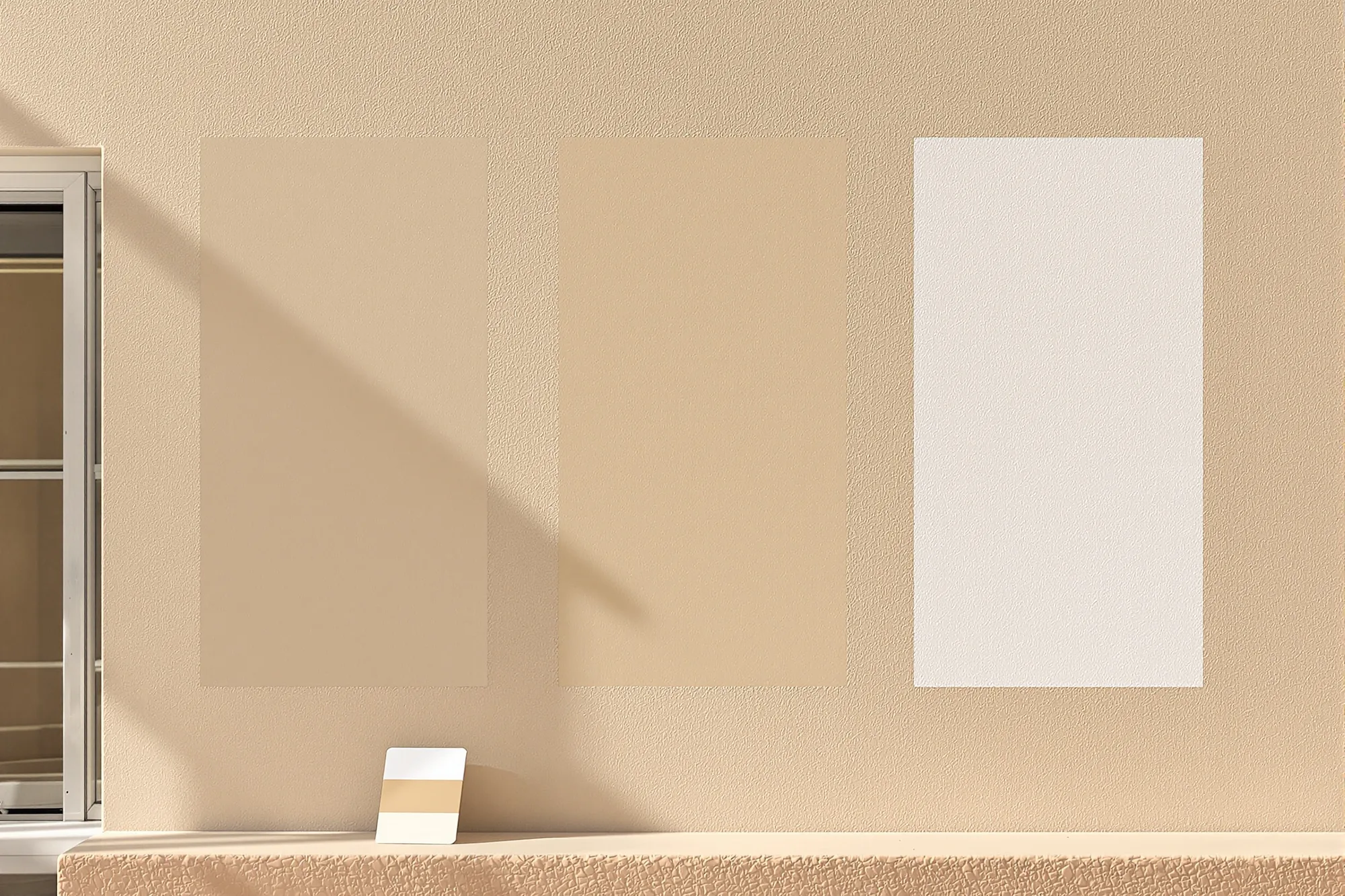 Three large sand, taupe and soft white paint samples on a fresh stucco wall in bright sun
